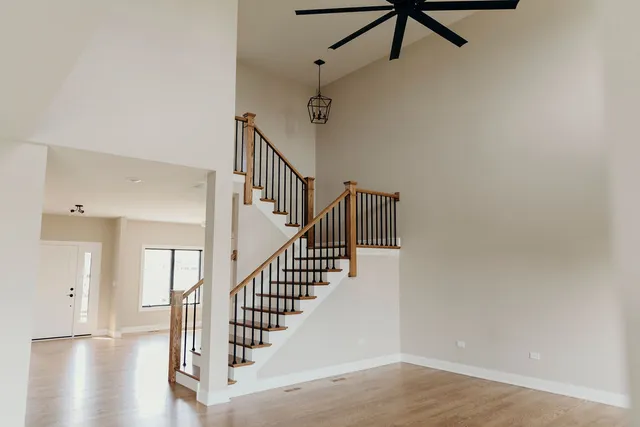 a view of entryway and hall with wooden floor