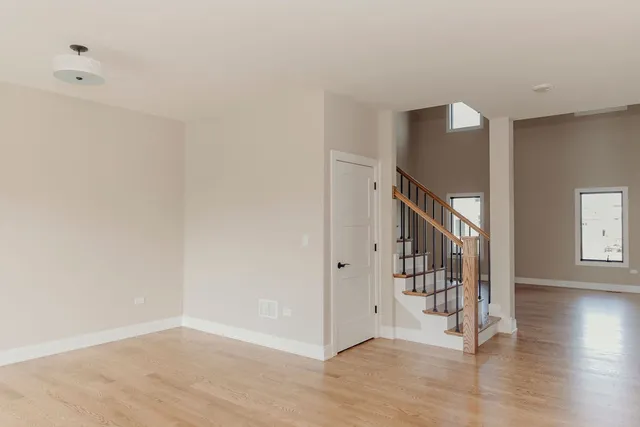 a view of an entryway with wooden floor