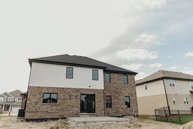 a front view of a house with parking space