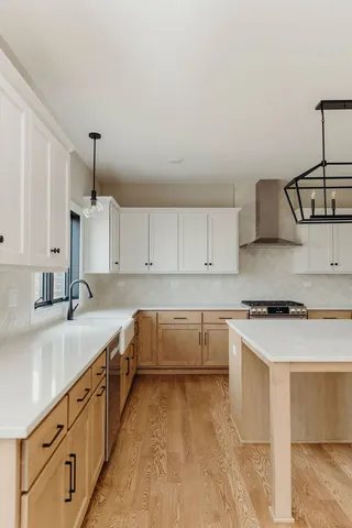 a kitchen that has a sink and a stove