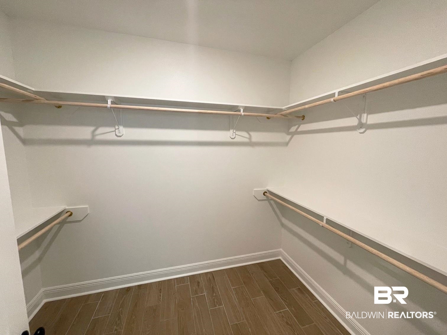1565 Fenton Circle Foley, AL 36535 - Photo 8 of 15 Walk in closet featuring dark hardwood / wood-style flooring