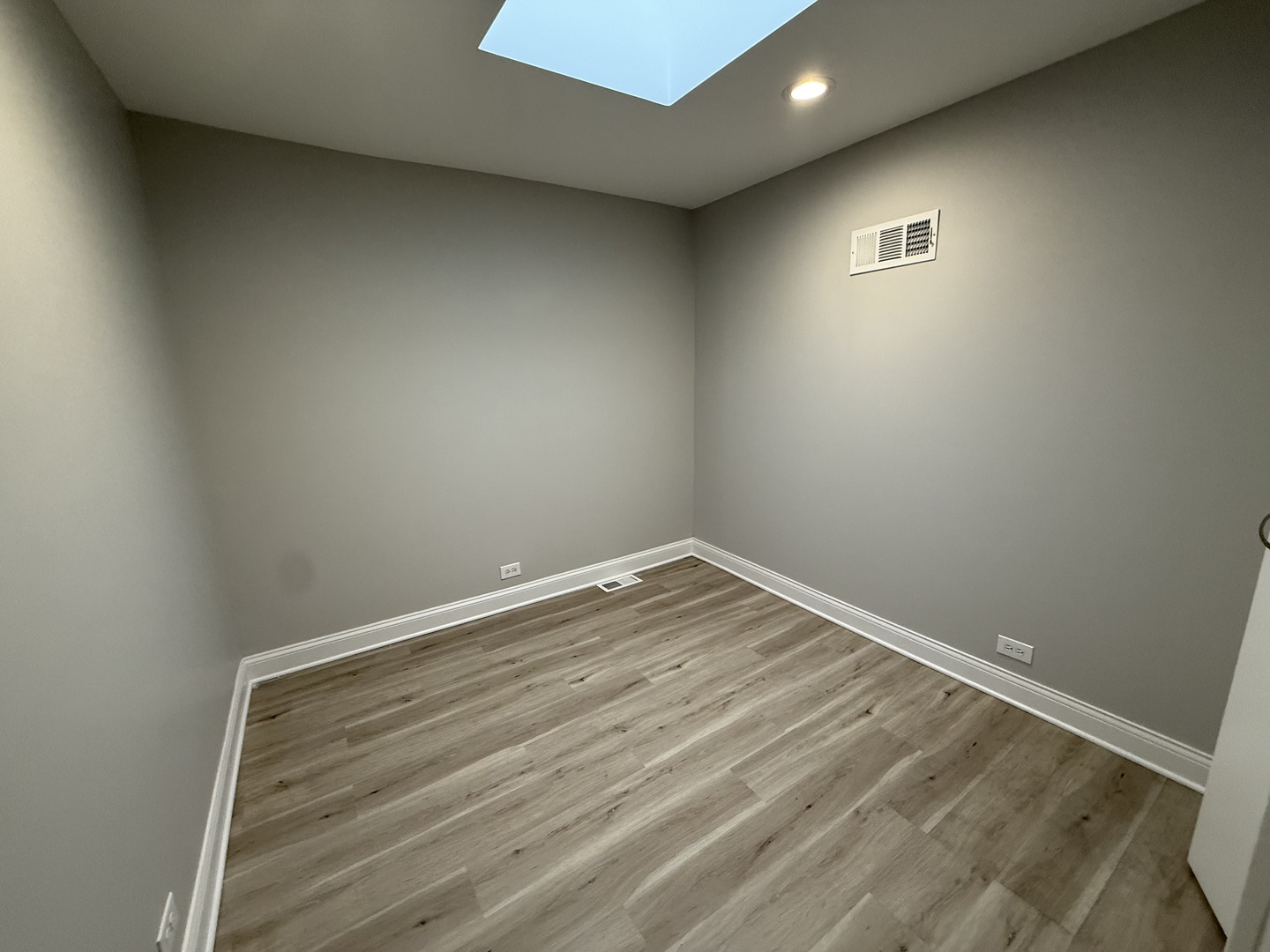 744 West Gordon Terrace, Unit 306 Chicago, IL 60613 - Photo 11 of 13 wooden floor in an empty room