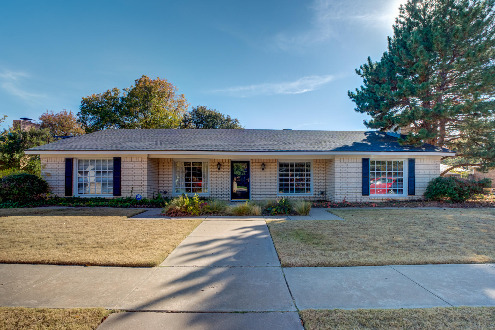 4629 88th Street Lubbock, TX 79424 - Photo 1 of 60 a front view of a house with a yard and a garage