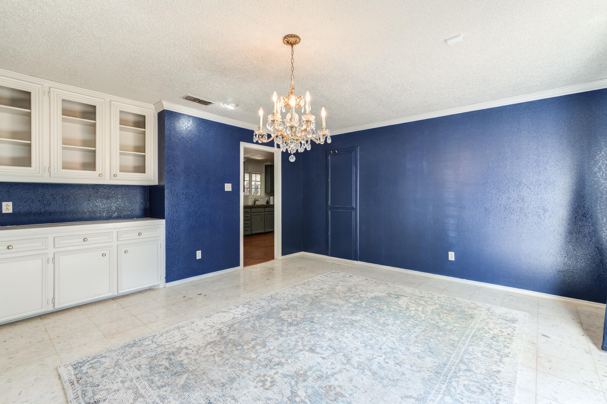 4629 88th Street Lubbock, TX 79424 - Photo 11 of 60 a view of a kitchen with cabinet and chandelier
