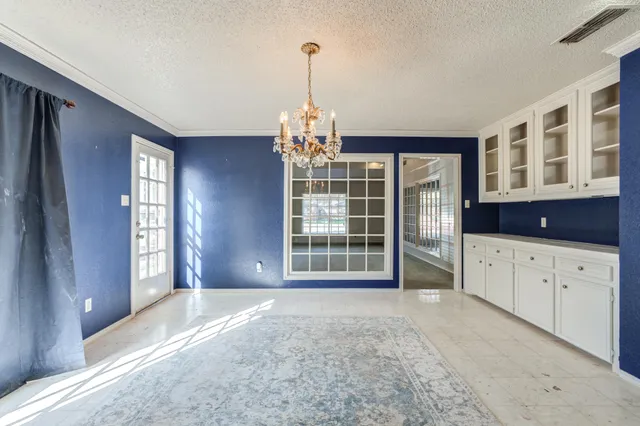 a view of kitchen with granite countertop cabinets and wooden floor
