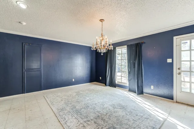 a kitchen with stainless steel appliances a stove a sink and a refrigerator