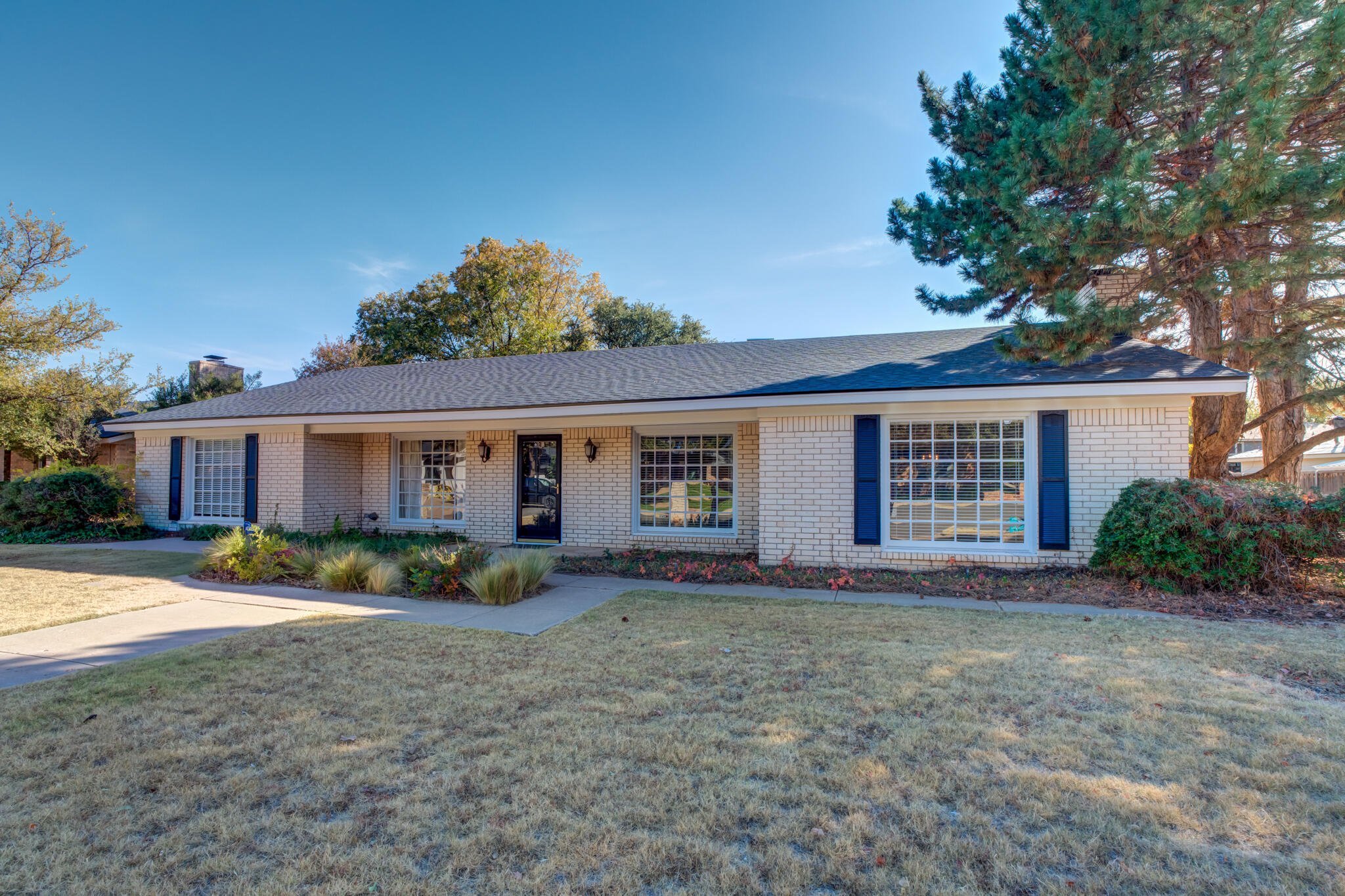 4629 88th Street Lubbock, TX 79424 - Photo 2 of 60 a view of a house with a yard and large tree