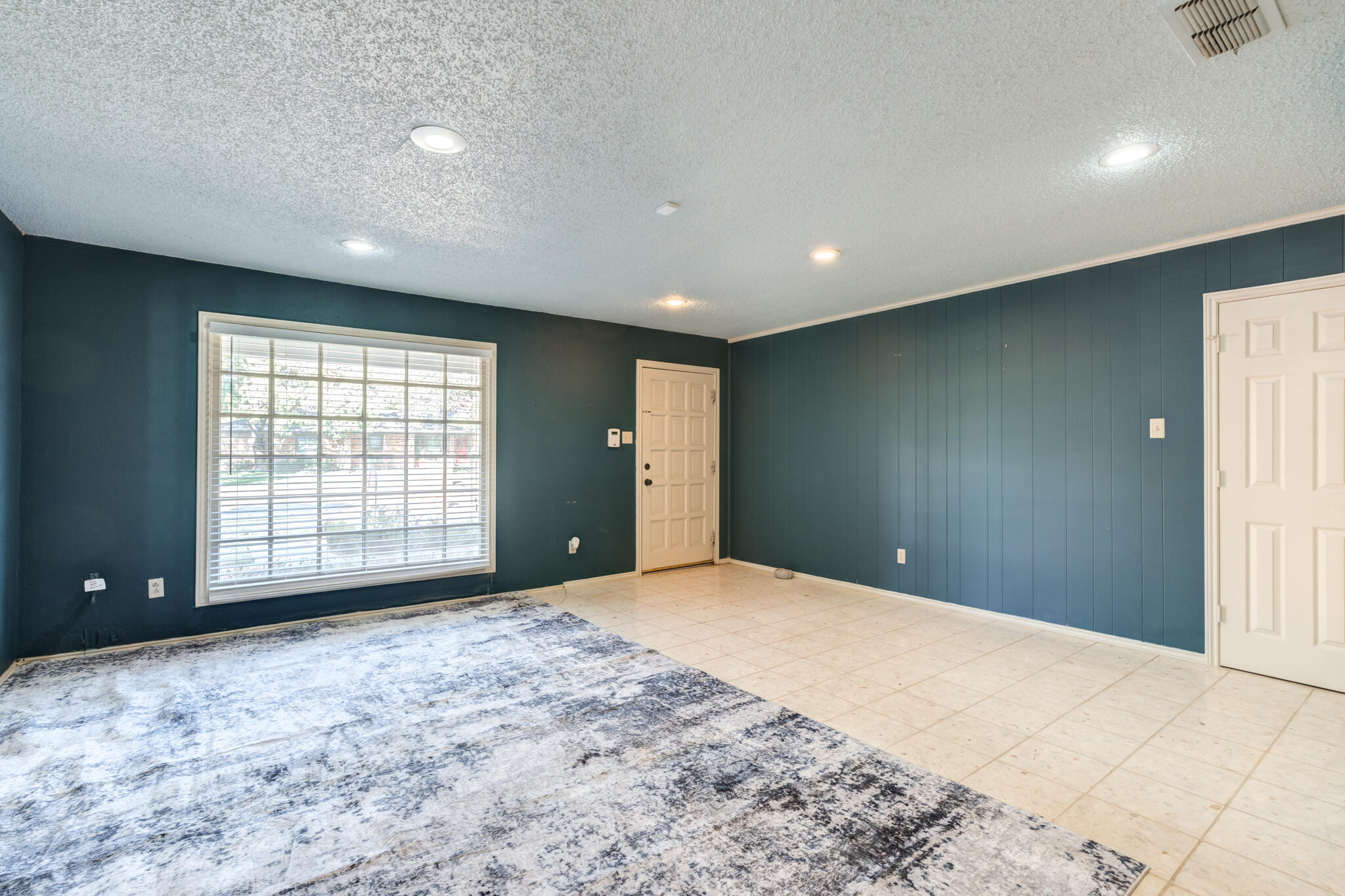 4629 88th Street Lubbock, TX 79424 - Photo 27 of 60 a view of an empty room with a window
