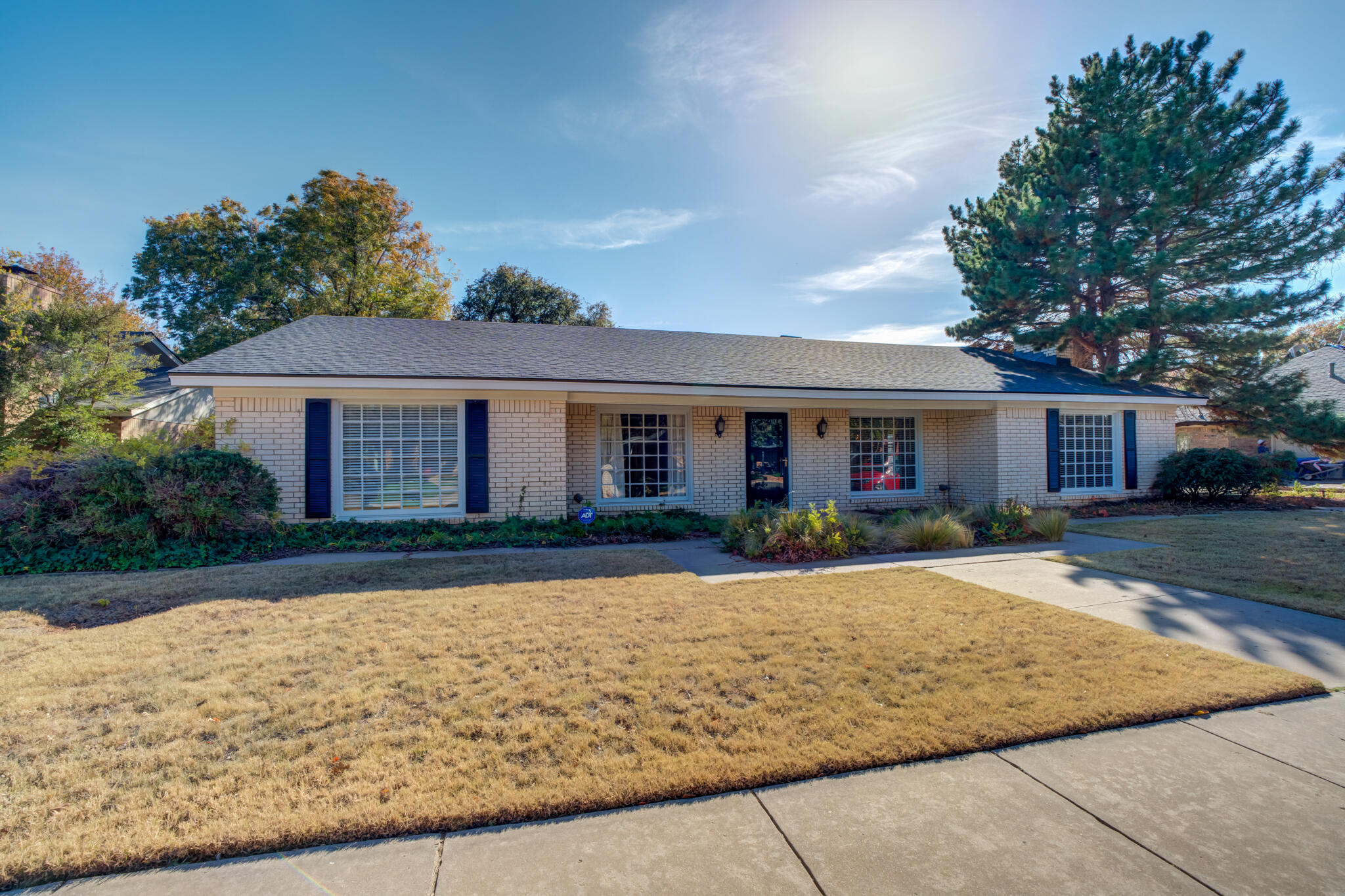 4629 88th Street Lubbock, TX 79424 - Photo 3 of 60 front view of a house with a yard