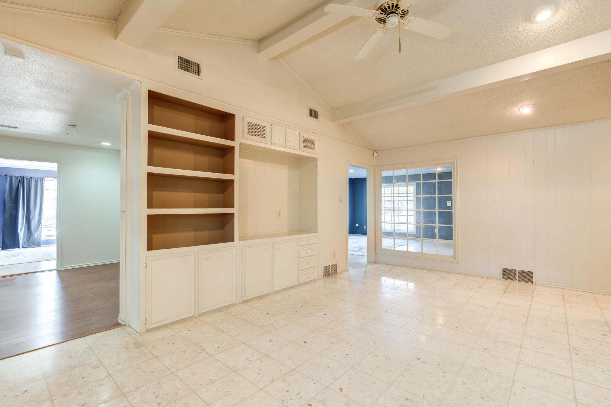 4629 88th Street Lubbock, TX 79424 - Photo 34 of 60 a view of an empty room with a window and wooden floor