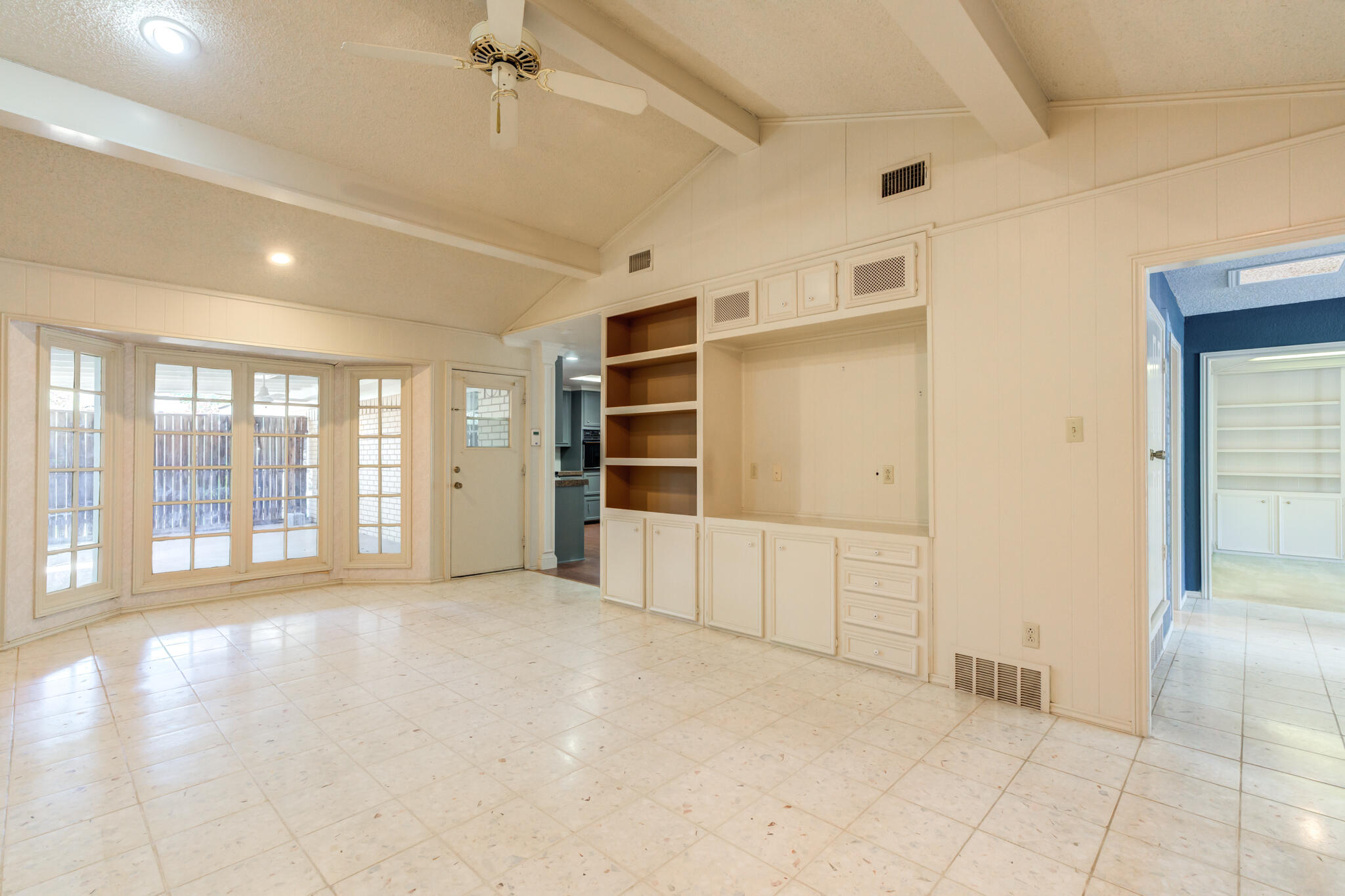 4629 88th Street Lubbock, TX 79424 - Photo 35 of 60 a view of an empty room with a window and a kitchen