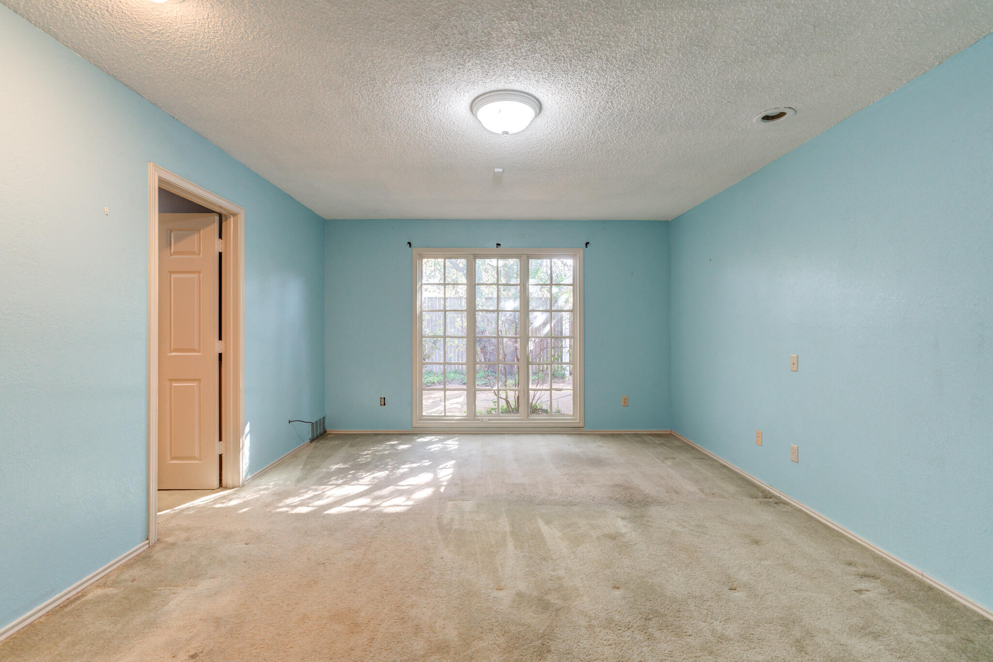 4629 88th Street Lubbock, TX 79424 - Photo 40 of 60 a view of an empty room with a window