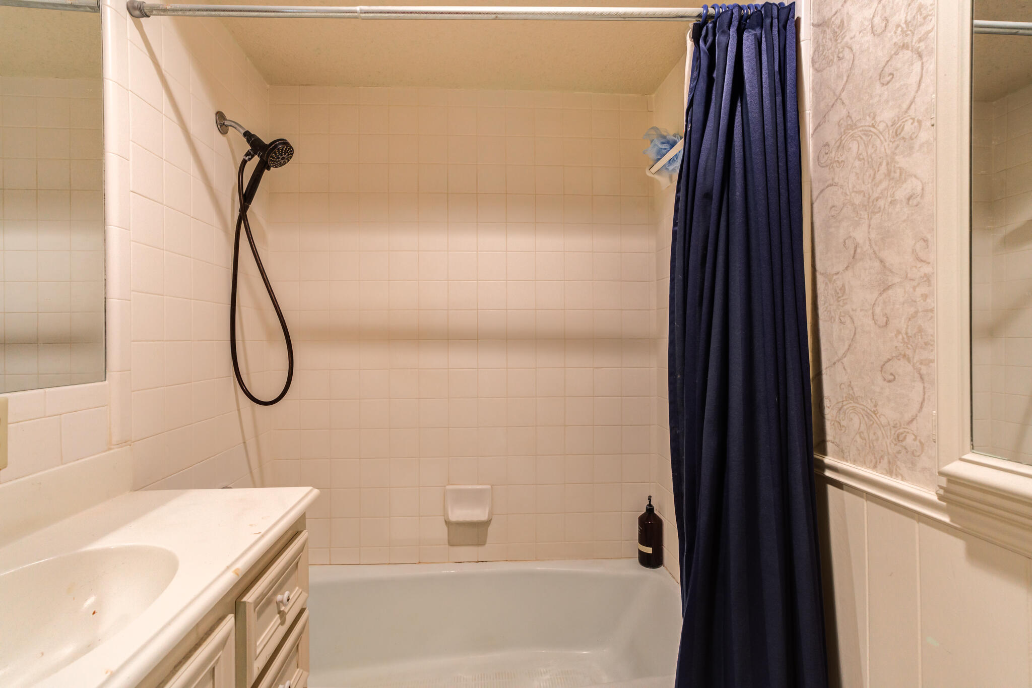 4629 88th Street Lubbock, TX 79424 - Photo 44 of 60 a bathroom with a granite countertop sink a vanity and shower