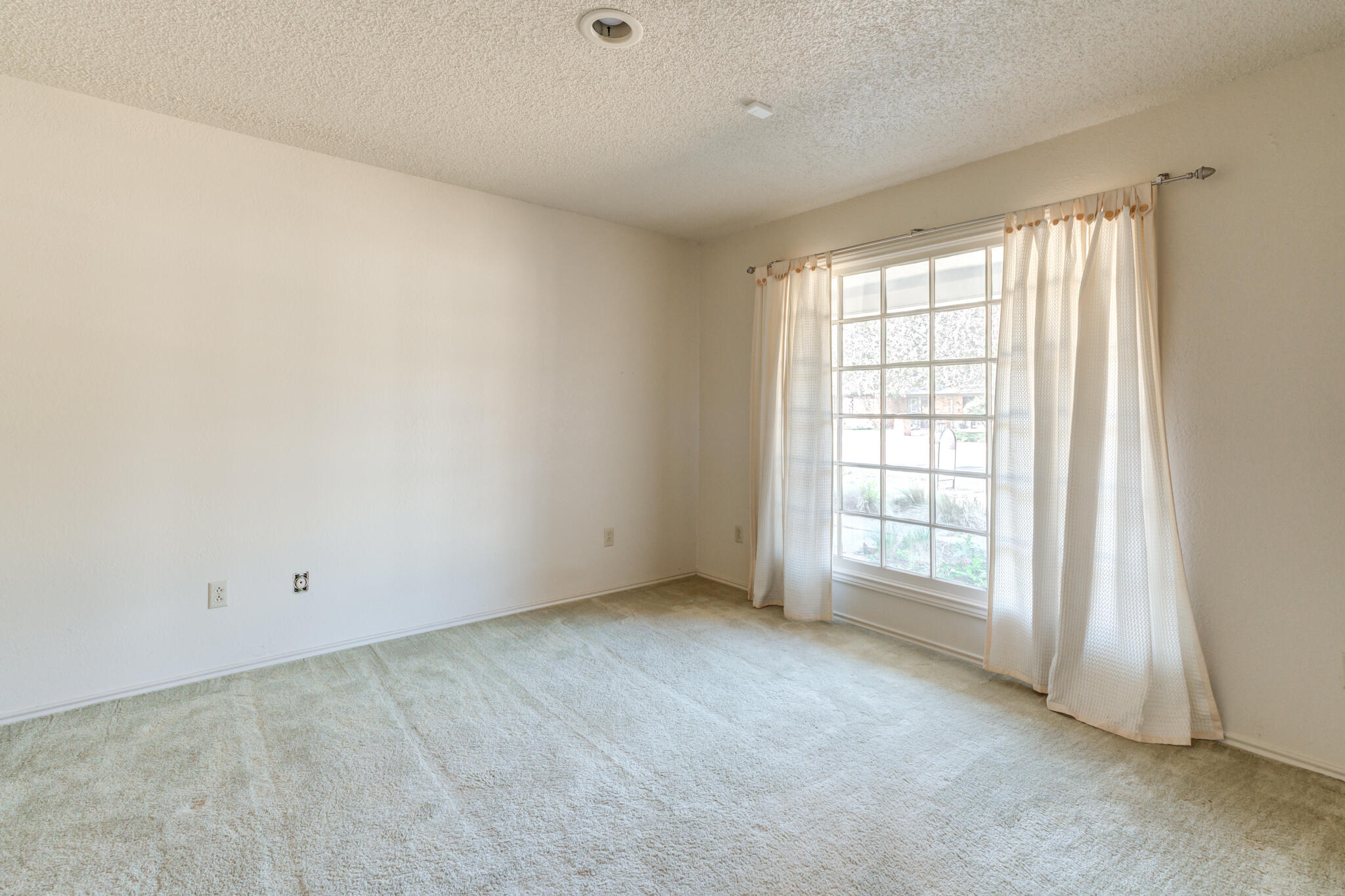 4629 88th Street Lubbock, TX 79424 - Photo 52 of 60 an empty room with windows