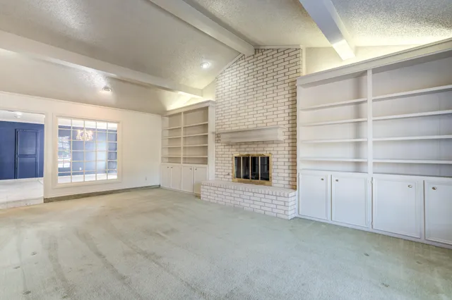 a view of a kitchen with cabinet and chandelier