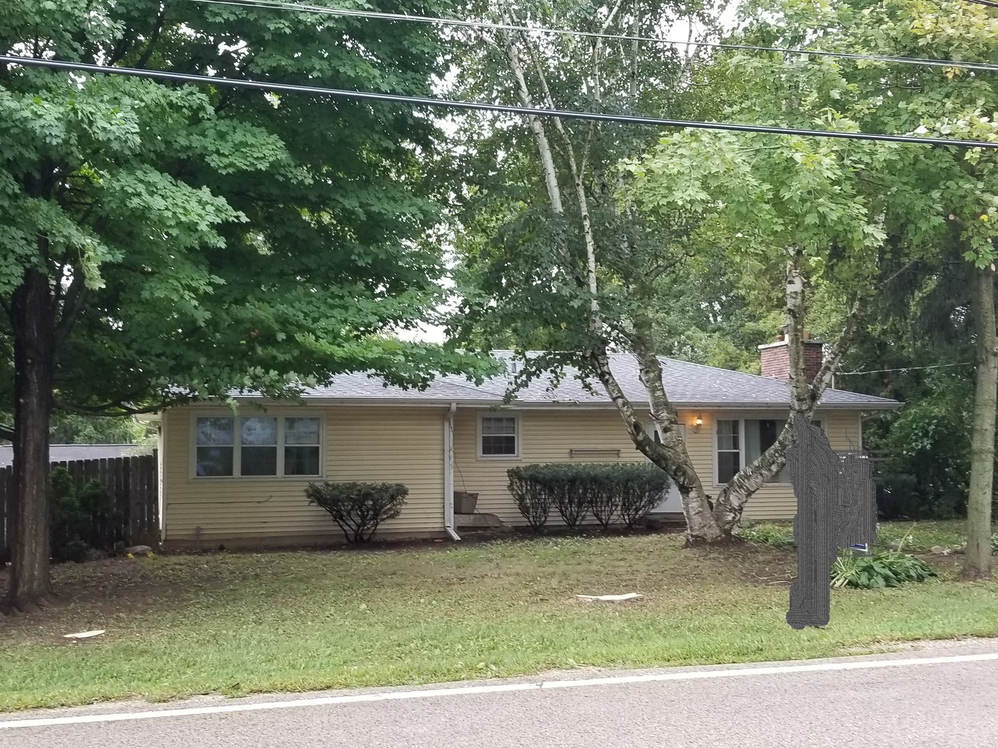26649 West Wilmot Road Antioch, IL 60002 - Photo 2 of 13 a front view of a house with a yard and garage
