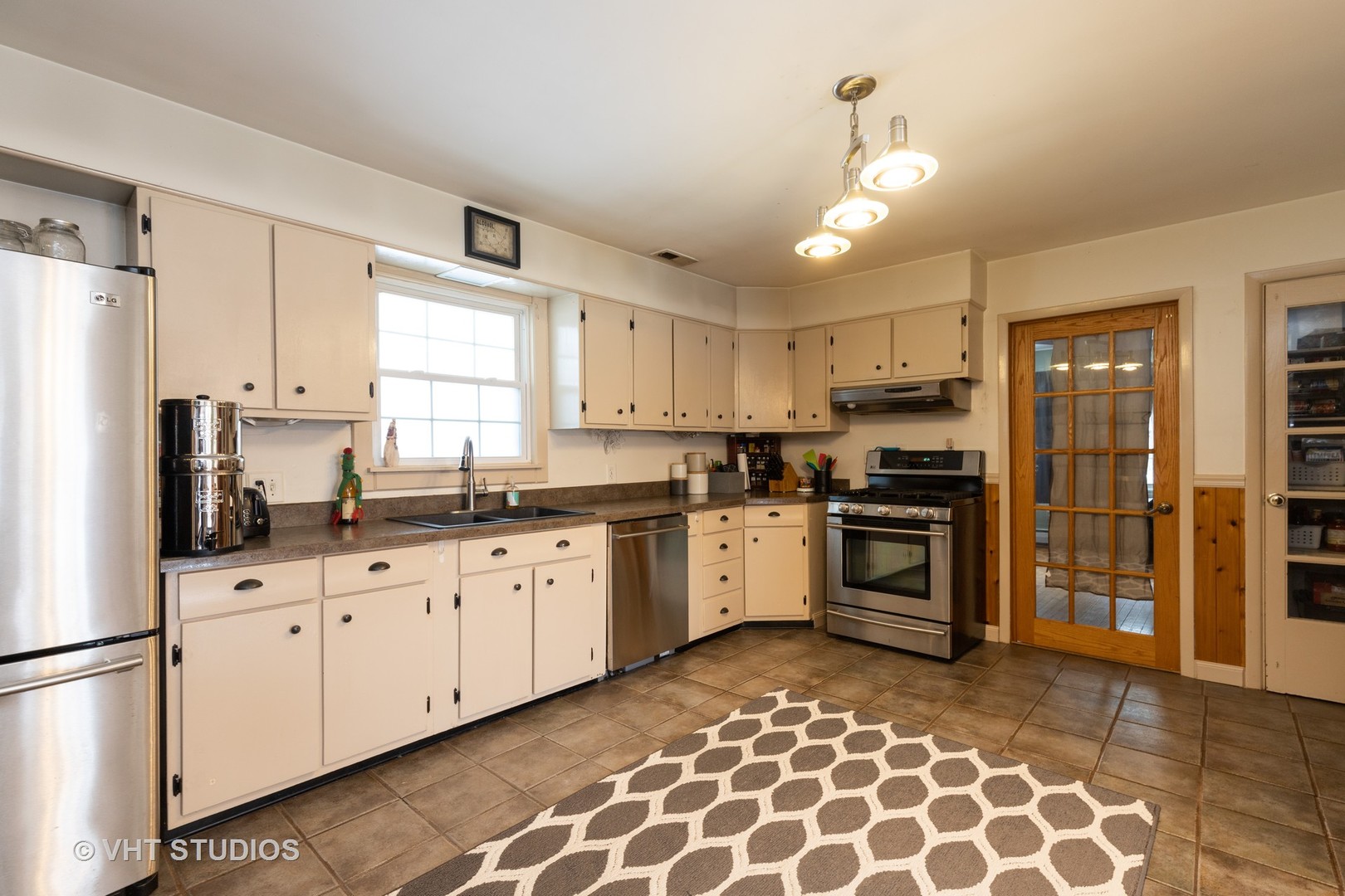 26649 West Wilmot Road Antioch, IL 60002 - Photo 5 of 13 a kitchen with granite countertop white cabinets and refrigerator