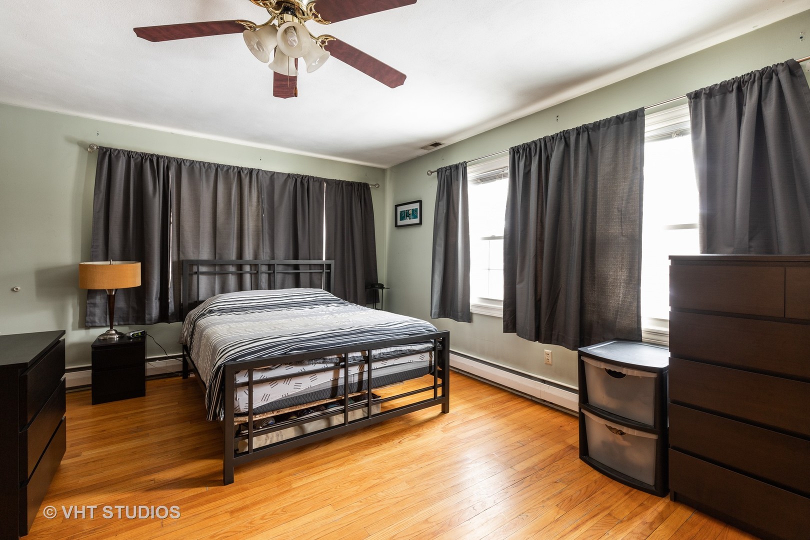 26649 West Wilmot Road Antioch, IL 60002 - Photo 10 of 13 a bedroom with a bed and a chandelier