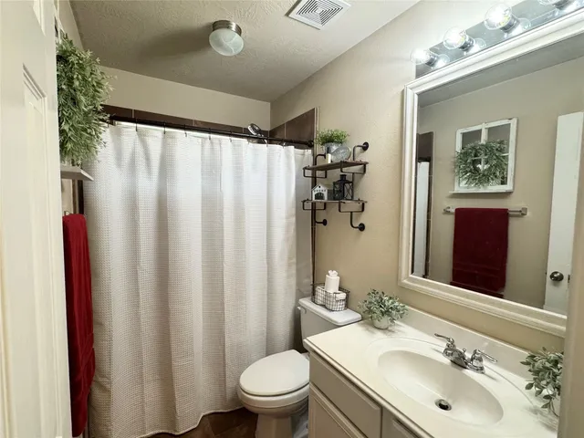 a bathroom with a tub and shower