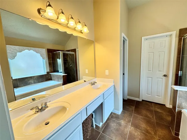 a view of backyard with wooden fence