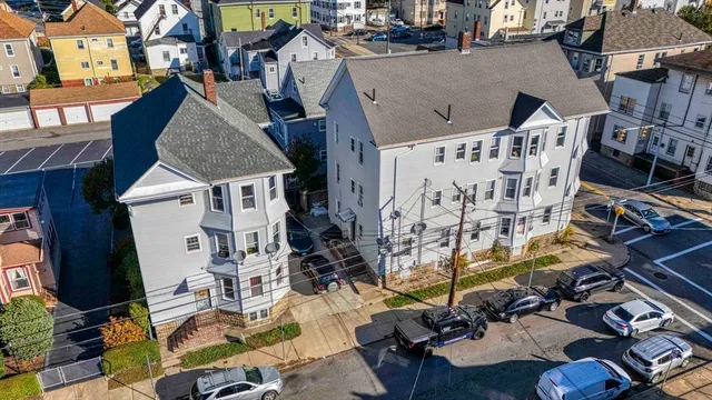 a view of multiple houses with outdoor space