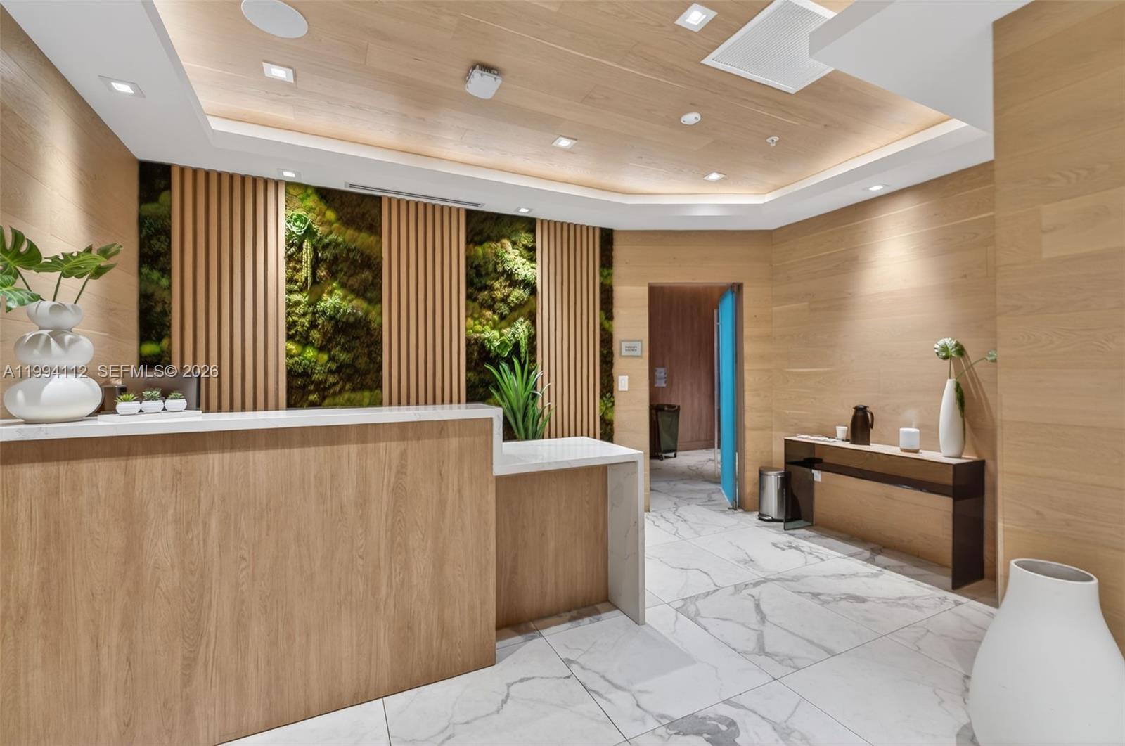 90 Southwest 3rd Street, Unit 1105 Miami, FL 33130 - Photo 3 of 11 a view of kitchen with stainless steel appliances wooden floor and large window