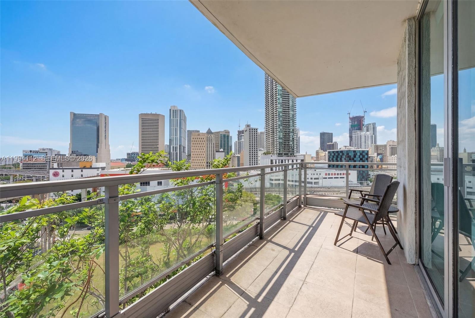 90 Southwest 3rd Street, Unit 1105 Miami, FL 33130 - Photo 5 of 11 a view of a balcony with wooden floor