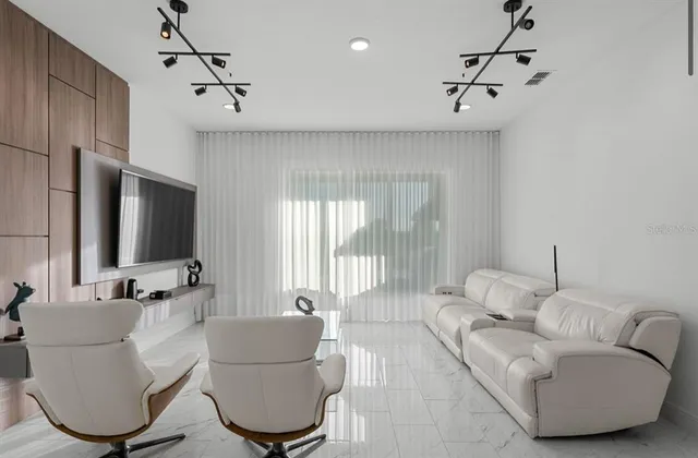 a view of a swimming pool with an outdoor seating