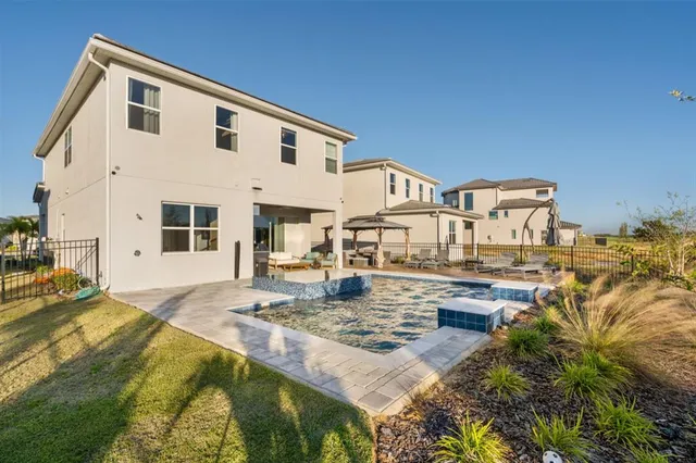 a view of a swimming pool with an outdoor seating