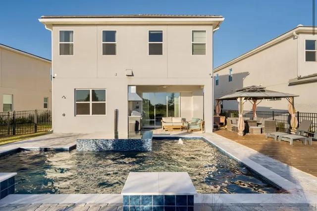 a kitchen with a sink and a stove top oven