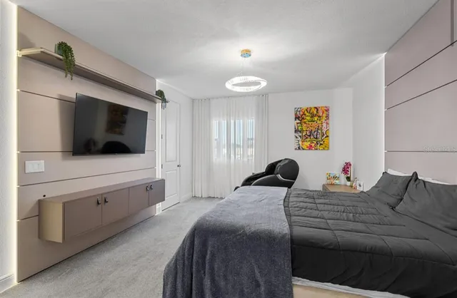 a bathroom with double vanity sinks a vanity a lamp and a mirror