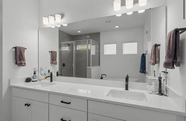 a bathroom with a bathtub and a shower