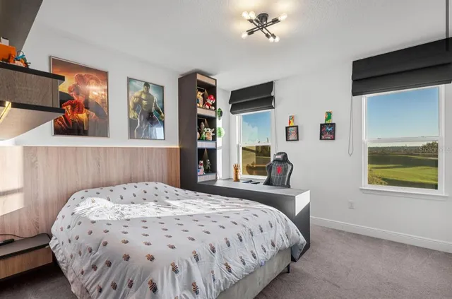 a bedroom with a bed and dresser