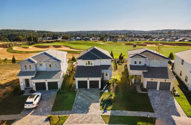 an aerial view of a residential building with outdoor space