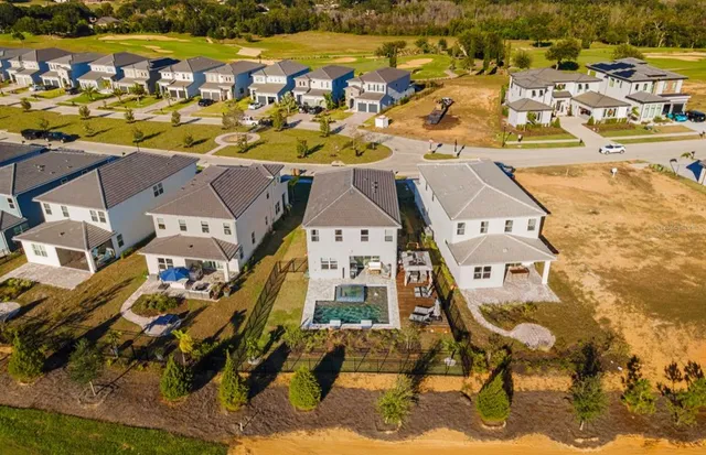 an aerial view of residential building with parking space