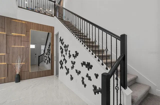 a view of staircase with wooden floor and stairs