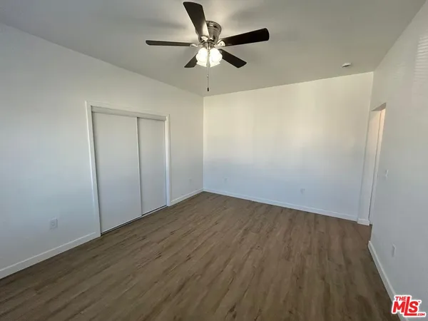 a view of a bathroom with wooden floor