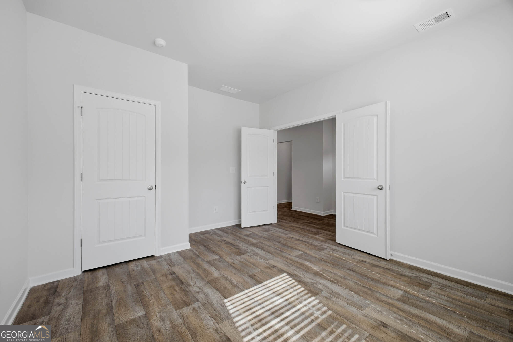 309 Rusty Plow Lane Perry, GA 31069 - Photo 17 of 34 a view of a livingroom with wooden floor and closet