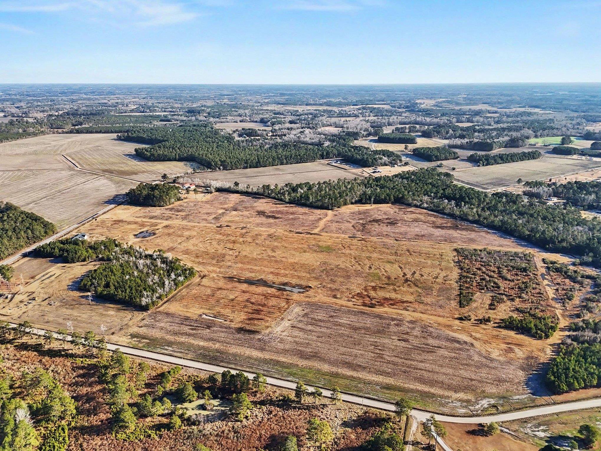 Tbd 87-acres Tbd 87-acres Airport Road Loris, SC 29569 - Photo 6 of 20 Aerial view of property and surrounding area with rural landscape and extensive farmland
