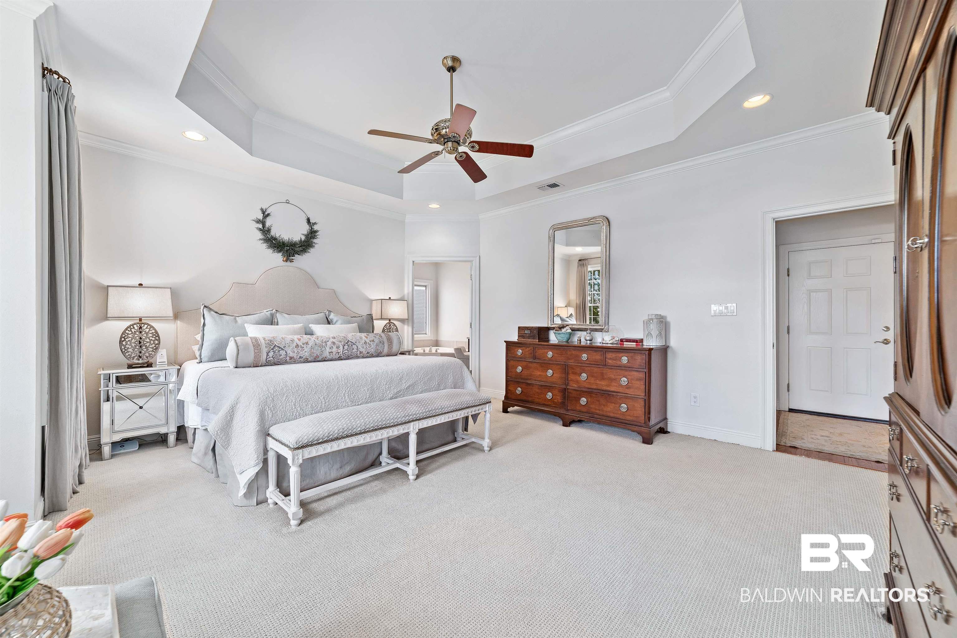 6630 East Quarry Drive Elberta, AL 36530 - Photo 22 of 63 Bedroom with a tray ceiling, ornamental molding, recessed lighting, light colored carpet, and a ceiling fan