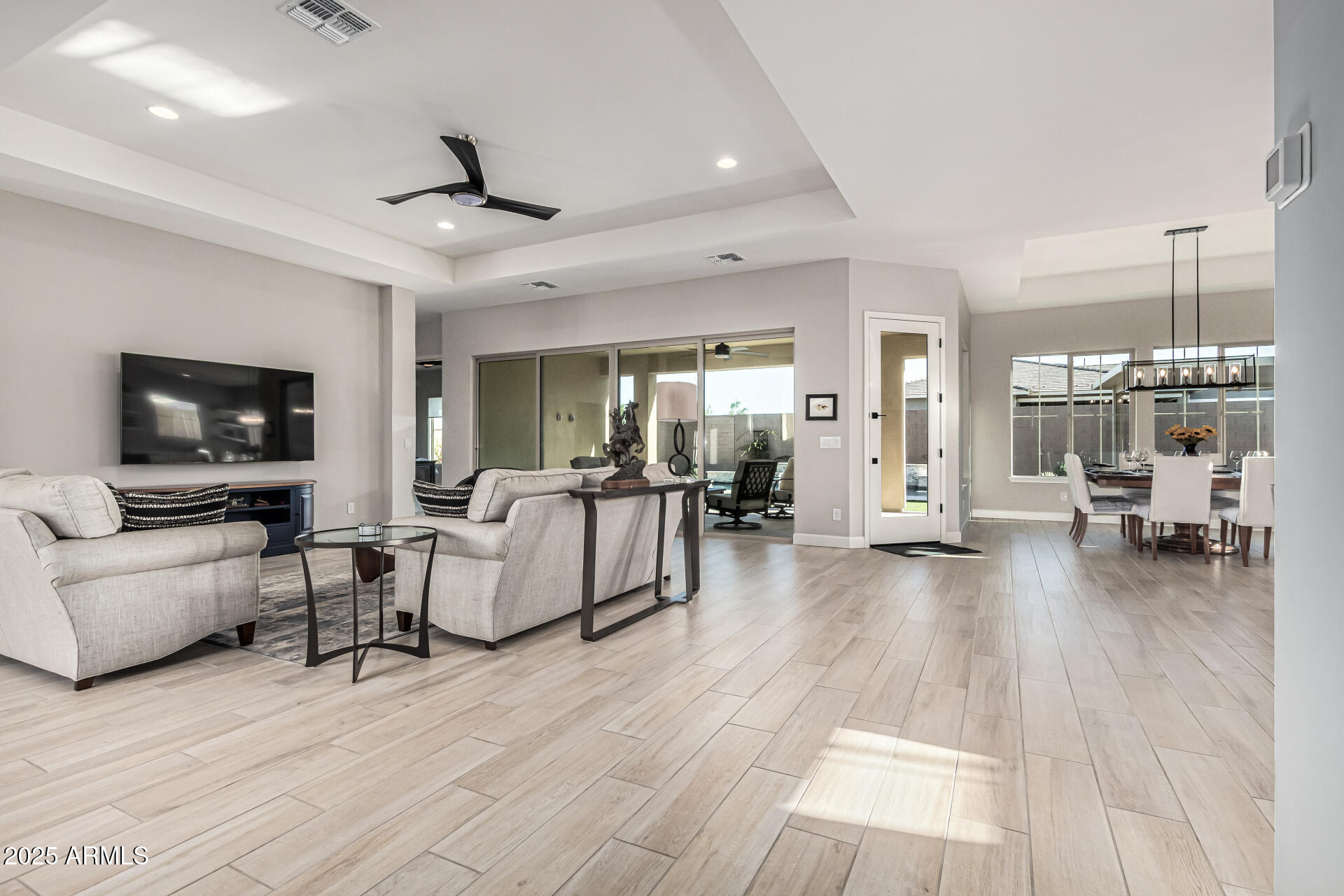 20709 West Rattler Road Buckeye, AZ 85396 - Photo 11 of 66 a living room with furniture and a flat screen tv