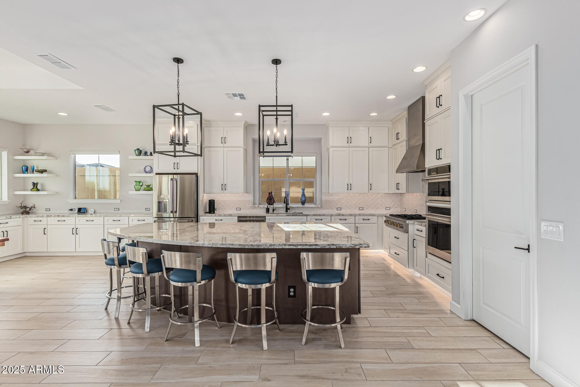 20709 West Rattler Road Buckeye, AZ 85396 - Photo 12 of 66 a large kitchen with a table and chairs