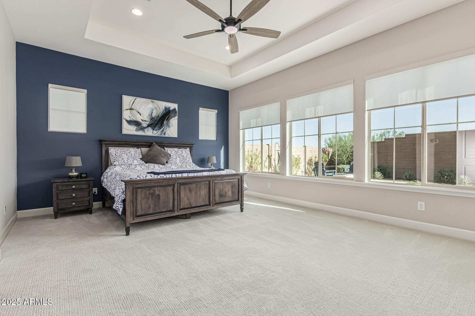 20709 West Rattler Road Buckeye, AZ 85396 - Photo 21 of 66 a bedroom with furniture and large window