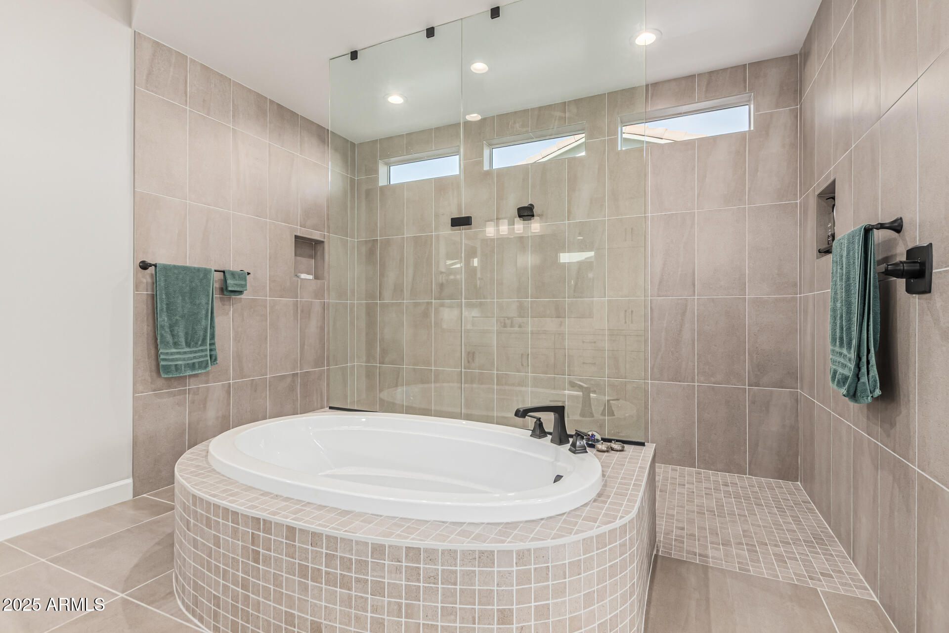 20709 West Rattler Road Buckeye, AZ 85396 - Photo 26 of 66 a bathroom with a bathtub and shower