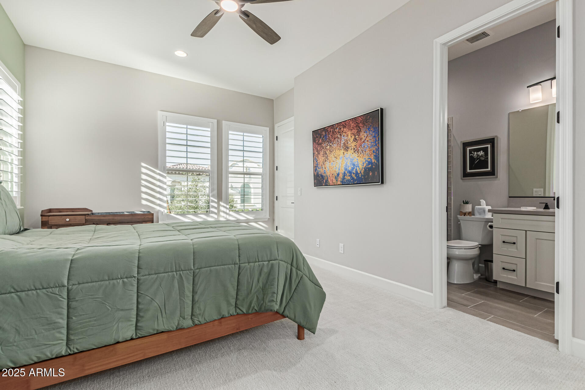 20709 West Rattler Road Buckeye, AZ 85396 - Photo 31 of 66 a bedroom with a bed and cabinets