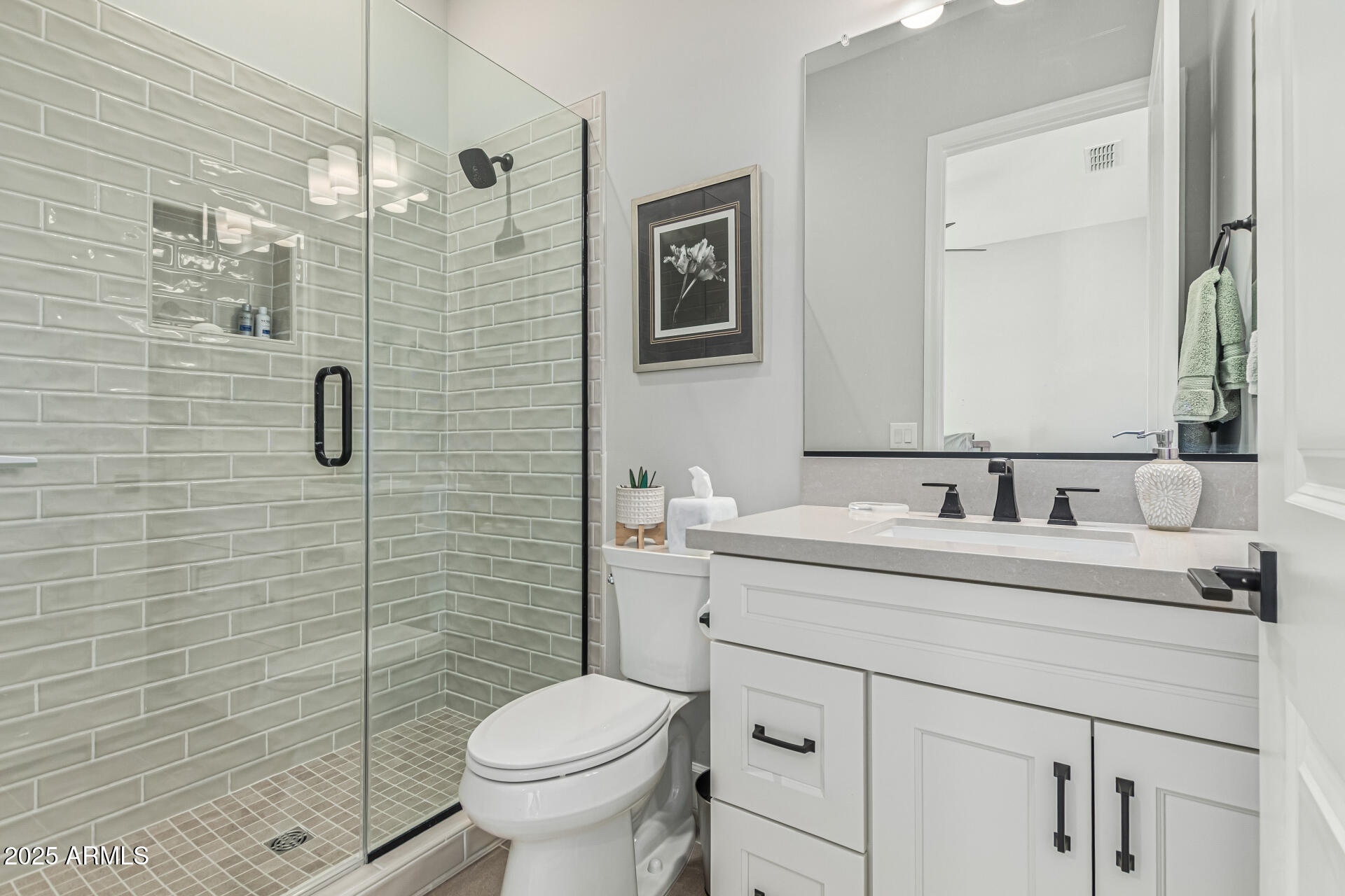 20709 West Rattler Road Buckeye, AZ 85396 - Photo 32 of 66 a bathroom with a sink a toilet and shower