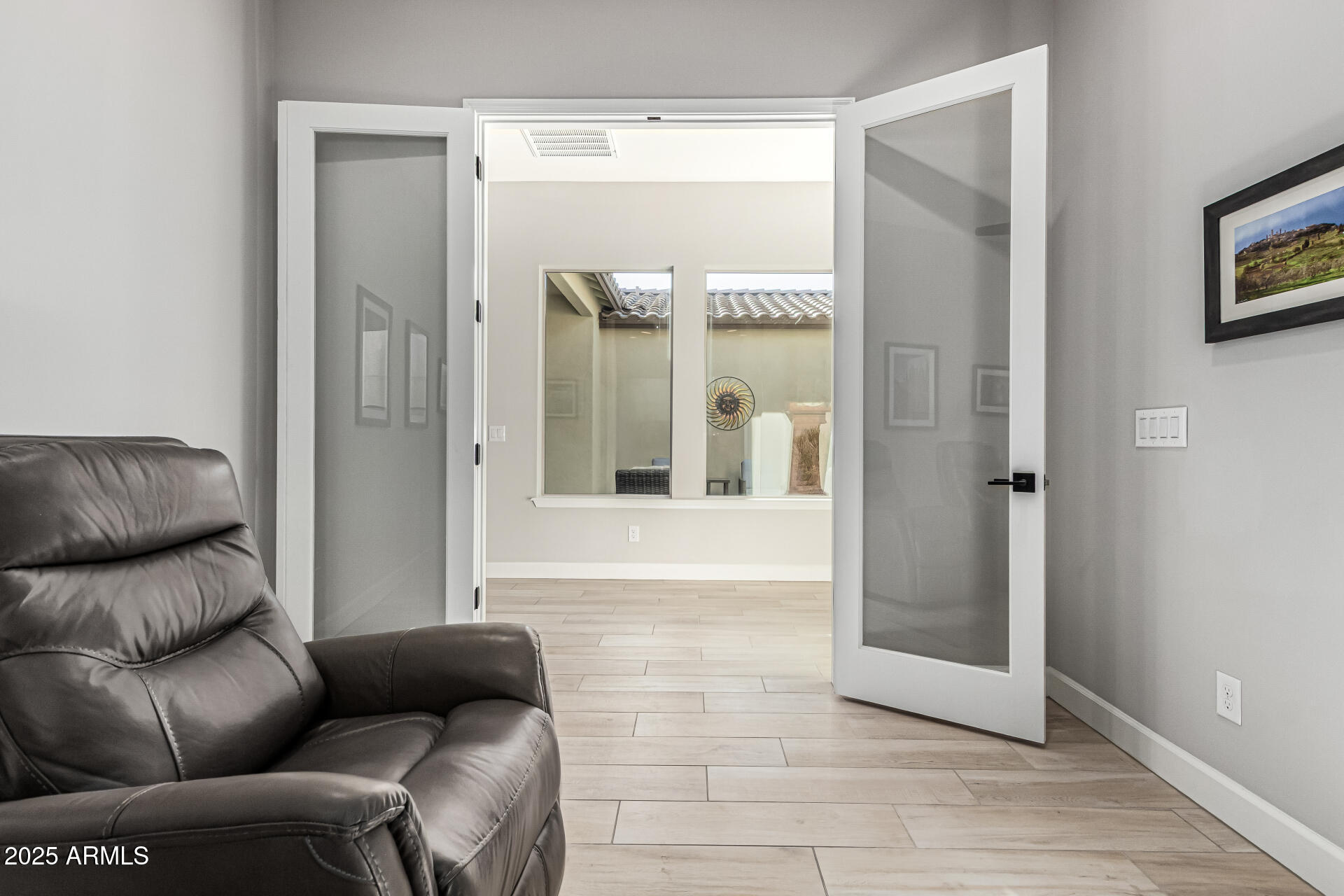 20709 West Rattler Road Buckeye, AZ 85396 - Photo 37 of 66 a living room with furniture and a glass door