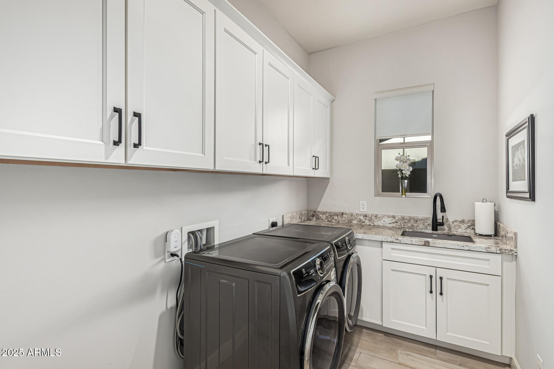 20709 West Rattler Road Buckeye, AZ 85396 - Photo 40 of 66 a utility room with sink dryer and washer
