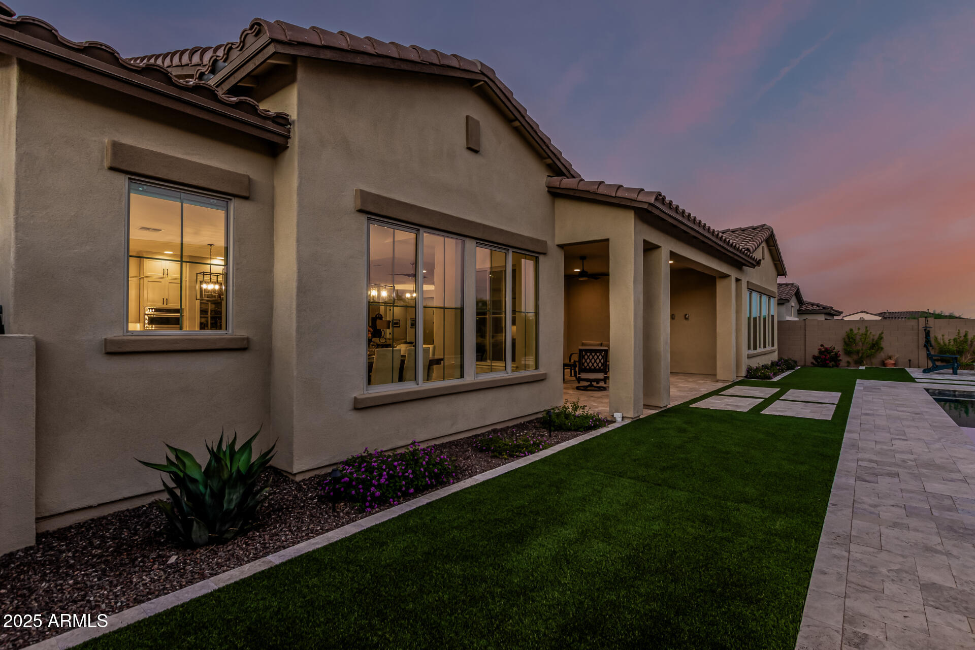20709 West Rattler Road Buckeye, AZ 85396 - Photo 43 of 66 a front view of a house with a garden