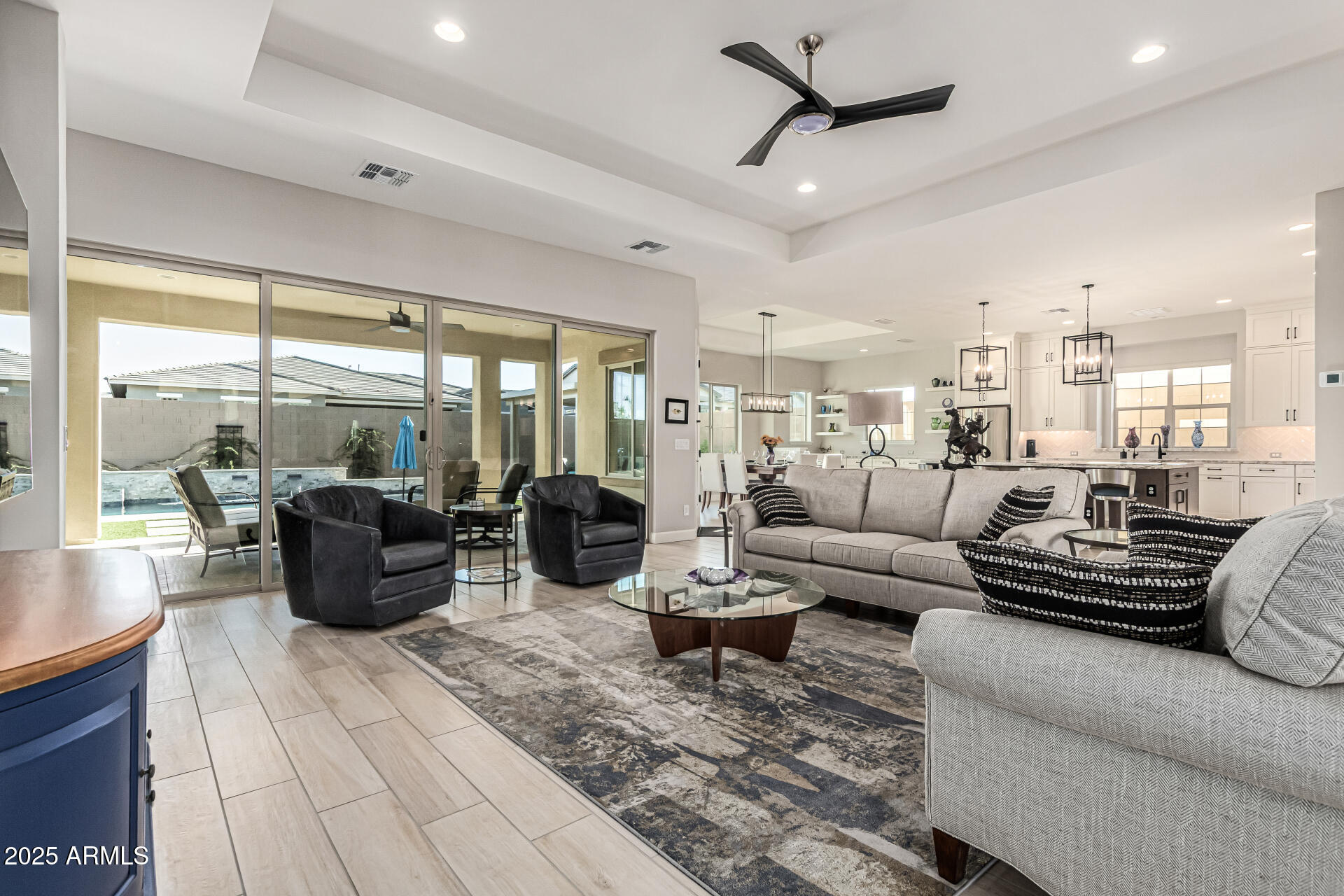20709 West Rattler Road Buckeye, AZ 85396 - Photo 8 of 66 a living room with furniture ceiling fan and a large window